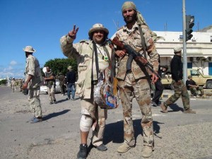 Matthew VanDyke American Freedom Fighter Rebel with singer guitar player Massoud Abu Assir in Sirte Libya War