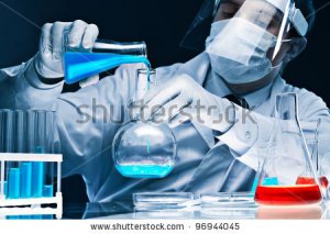 stock-photo-masked-male-scientist-mixing-bright-blue-substances-in-glassware-96944045