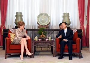In this Wednesday, July 28, 2015 photo provided by China's Xinhua News Agency, First Minister of Scotland Nicola Sturgeon, left, talks with Chinese State Councilor Yang Jiechi in Beijing. (Xinhua/Xie Huanchi/Xinhua News Agency via AP) ) NO SALES